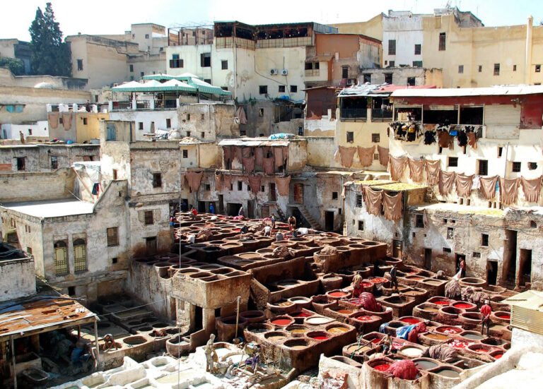 Lots of narrow streets, colors, people in the city of Fez